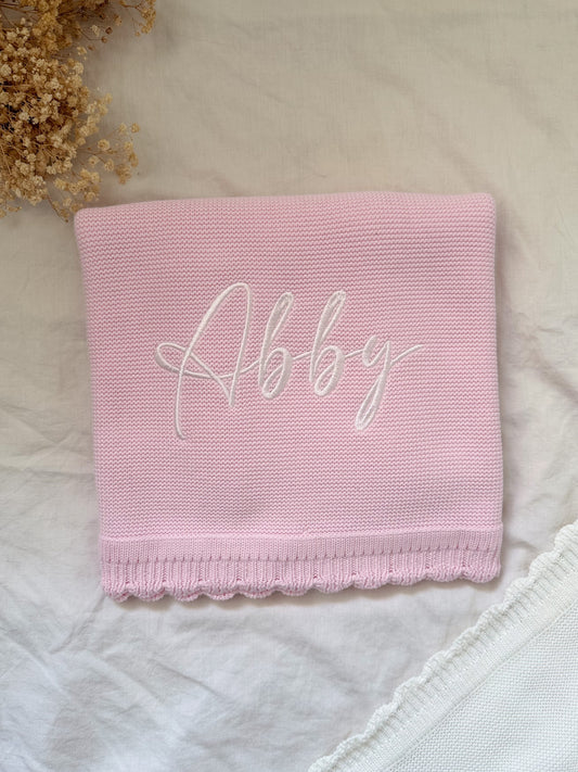 Plaid à bord festonné rose clair