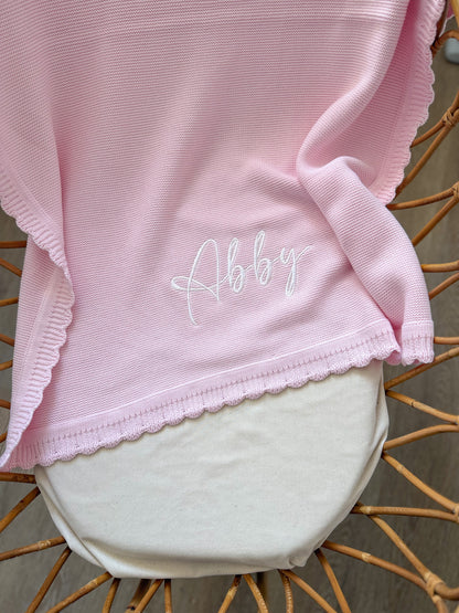 Plaid à bord festonné rose clair