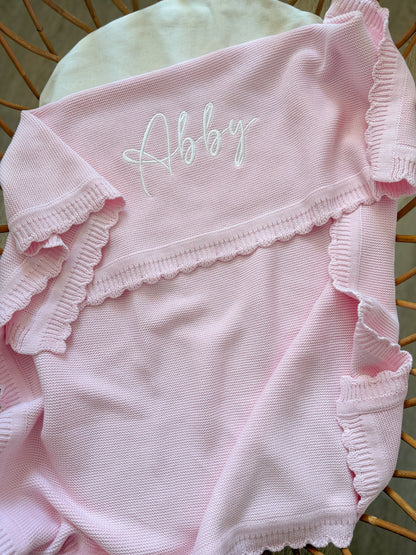 Plaid à bord festonné rose clair