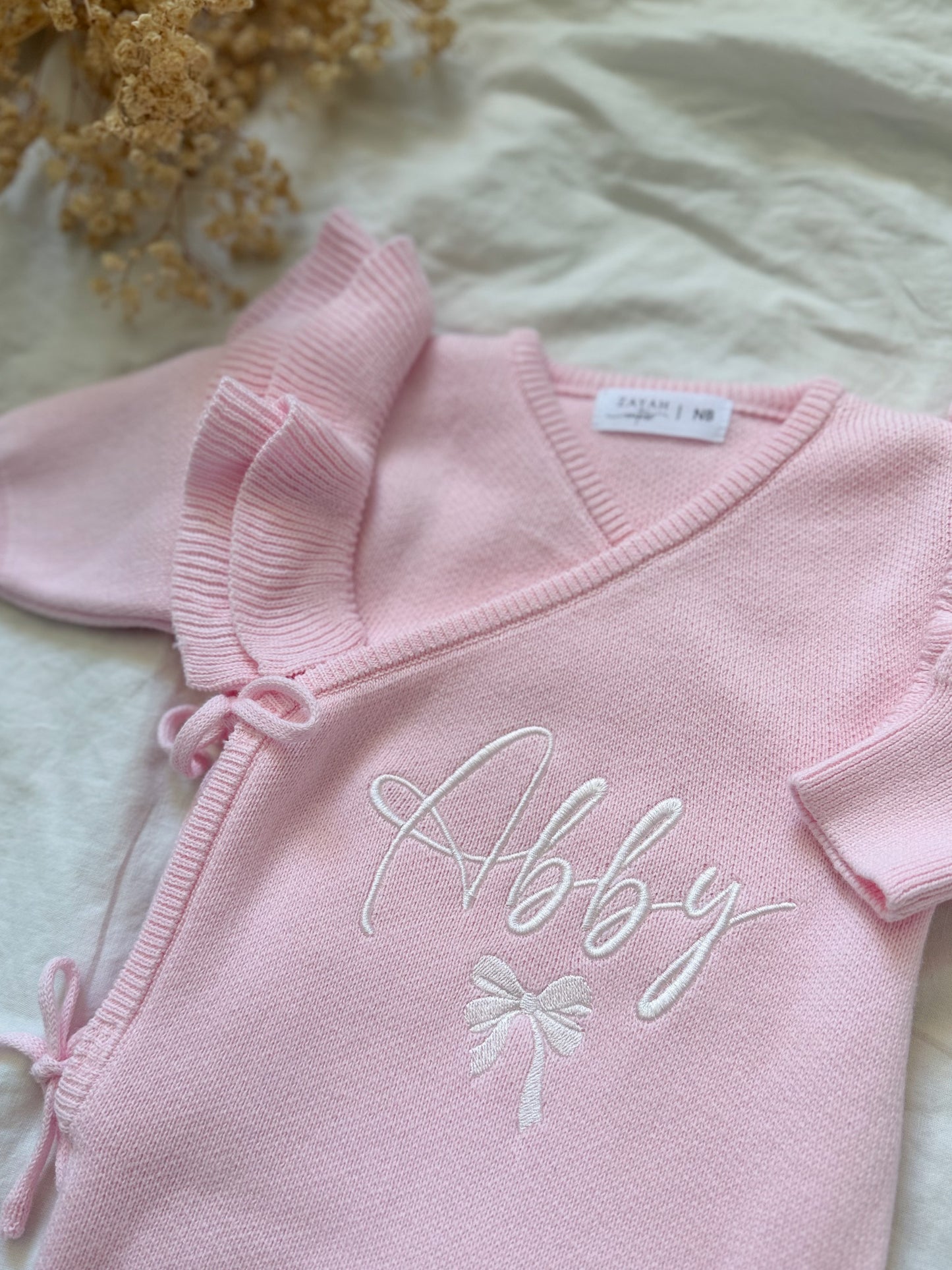 Combinaison à volants rose clair